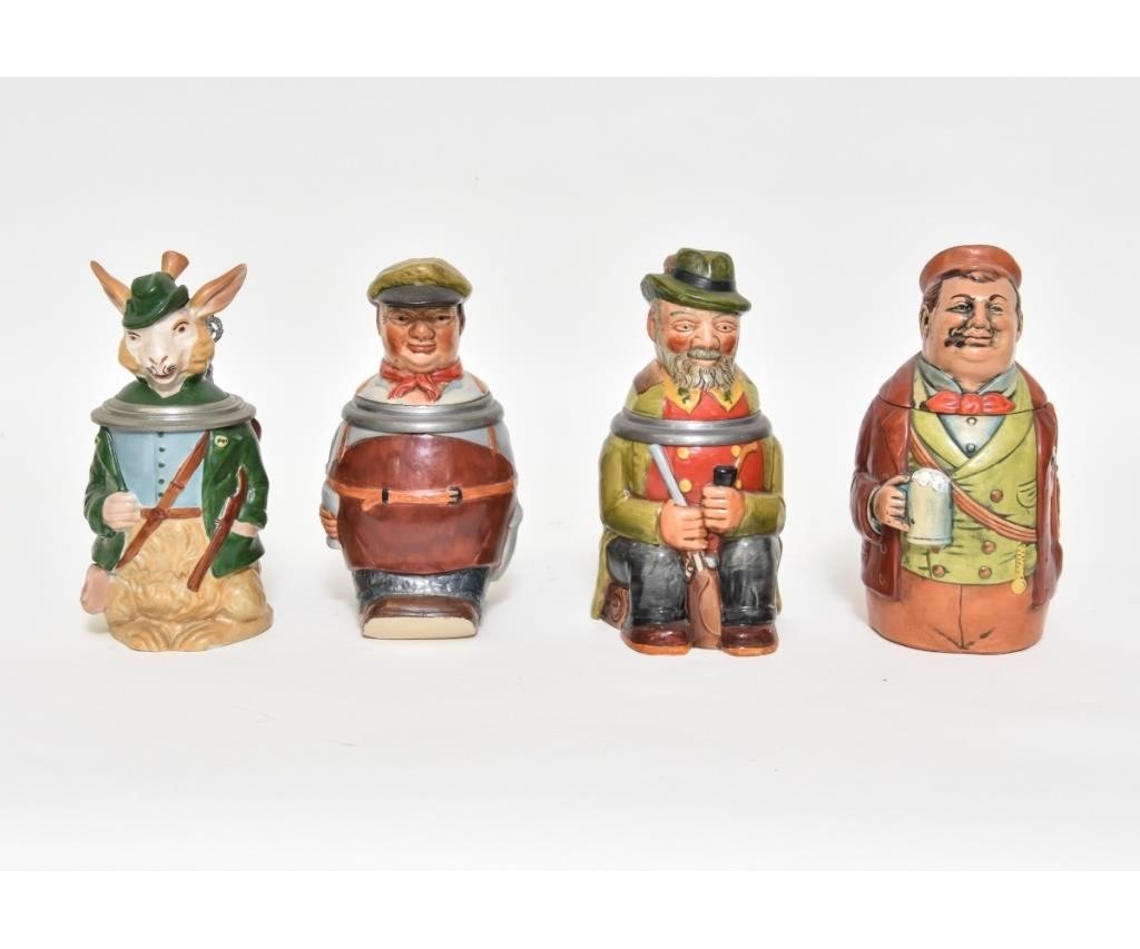 Four colorful German character steins,