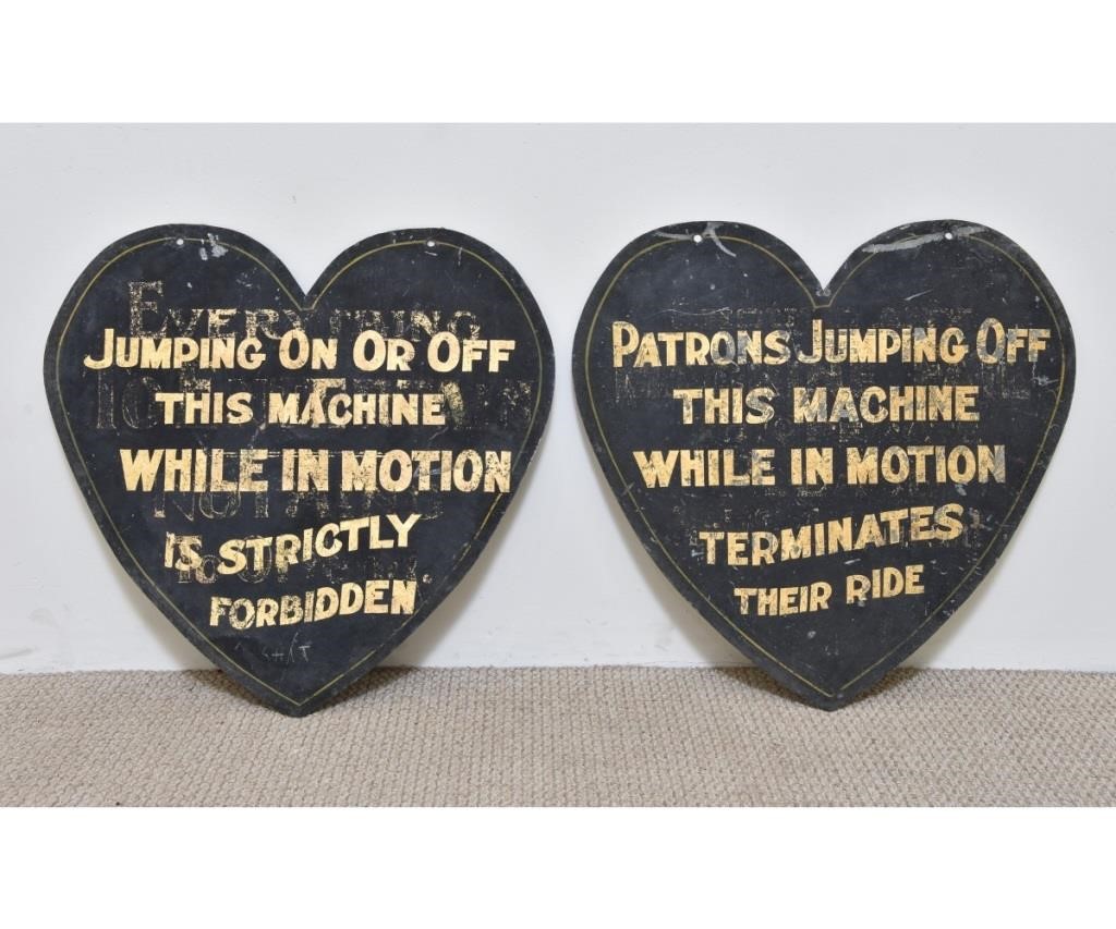 Two heart-shaped galvanized metal signs