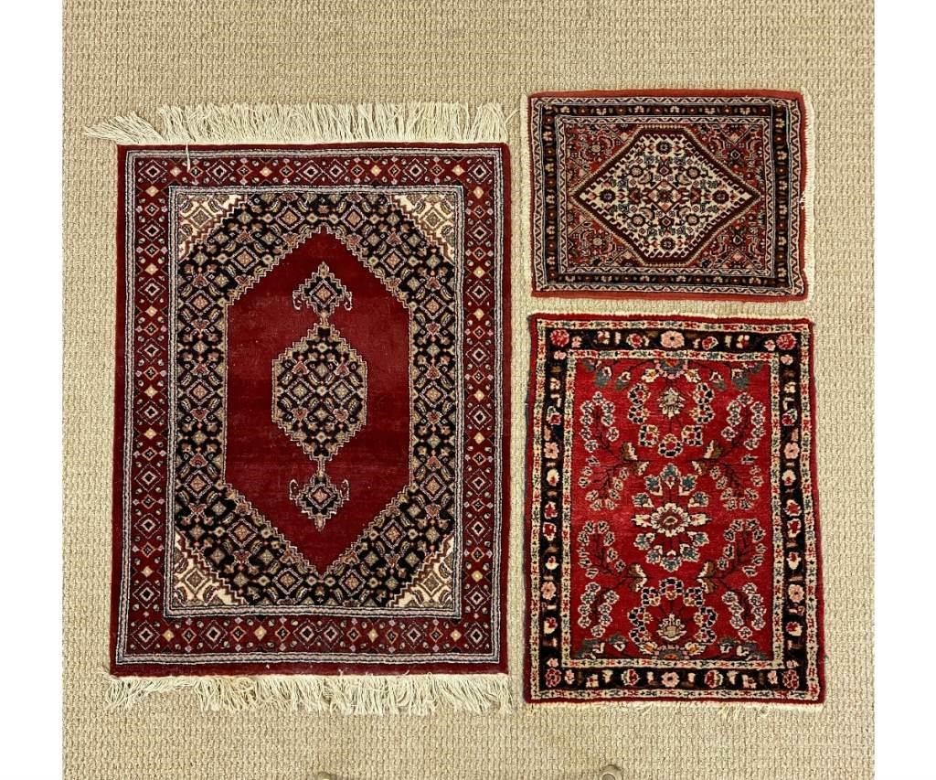 Three Persian mats all with red