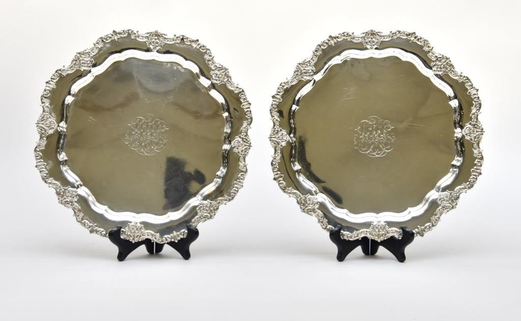 Two sterling silver plates with ornate