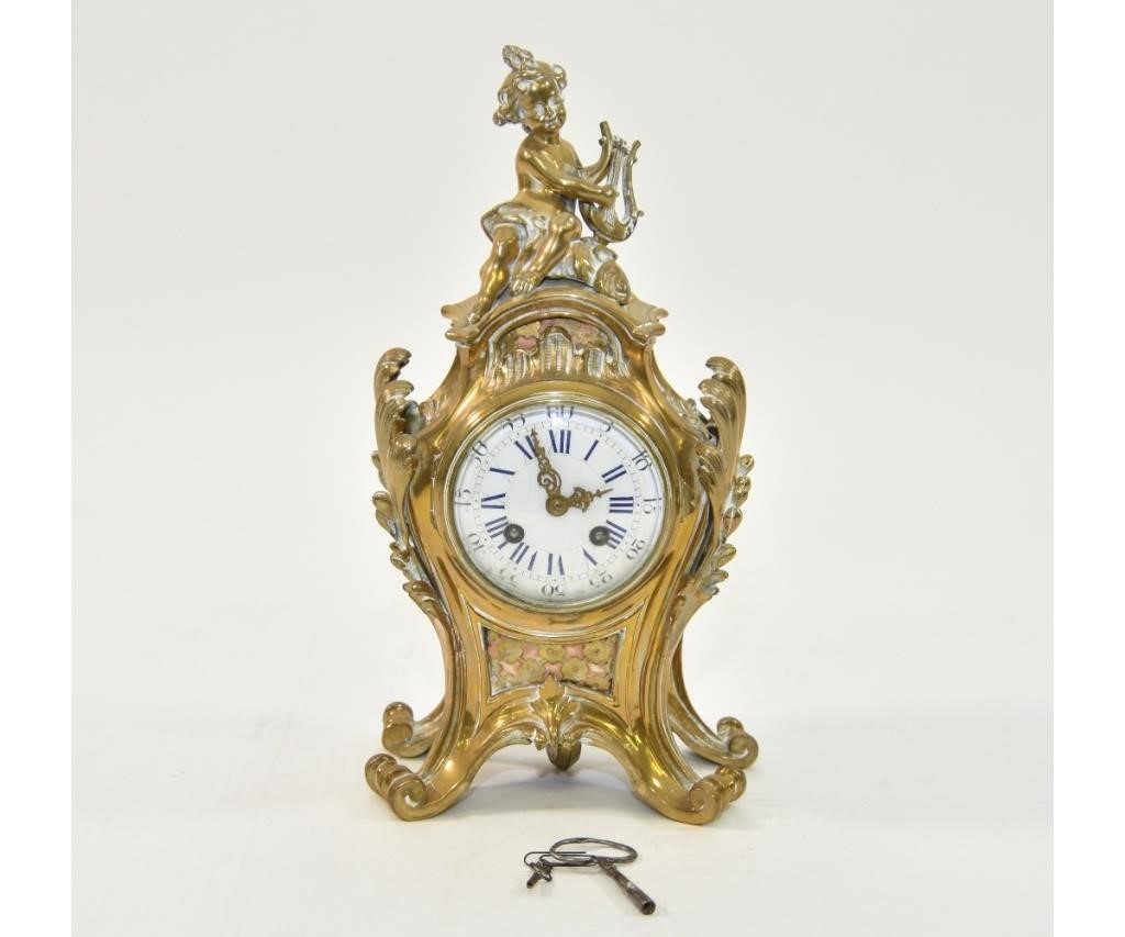 French brass mantel clock with porcelain