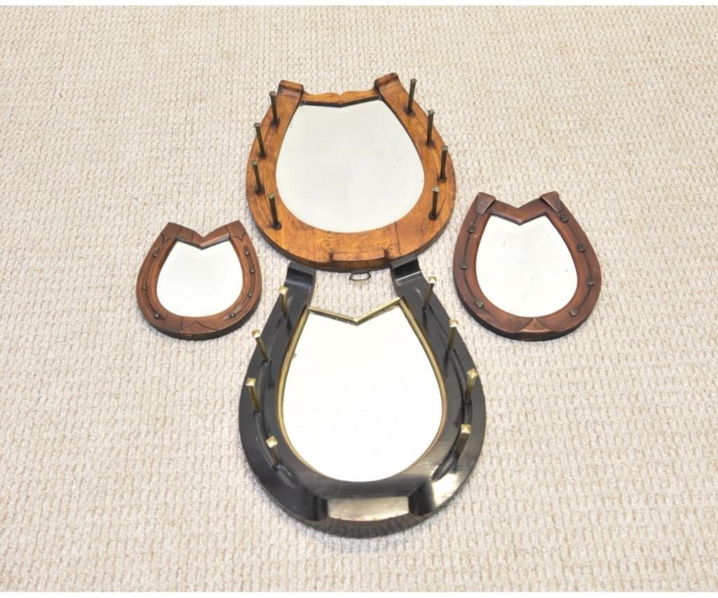 Two large horseshoe stable mirrors