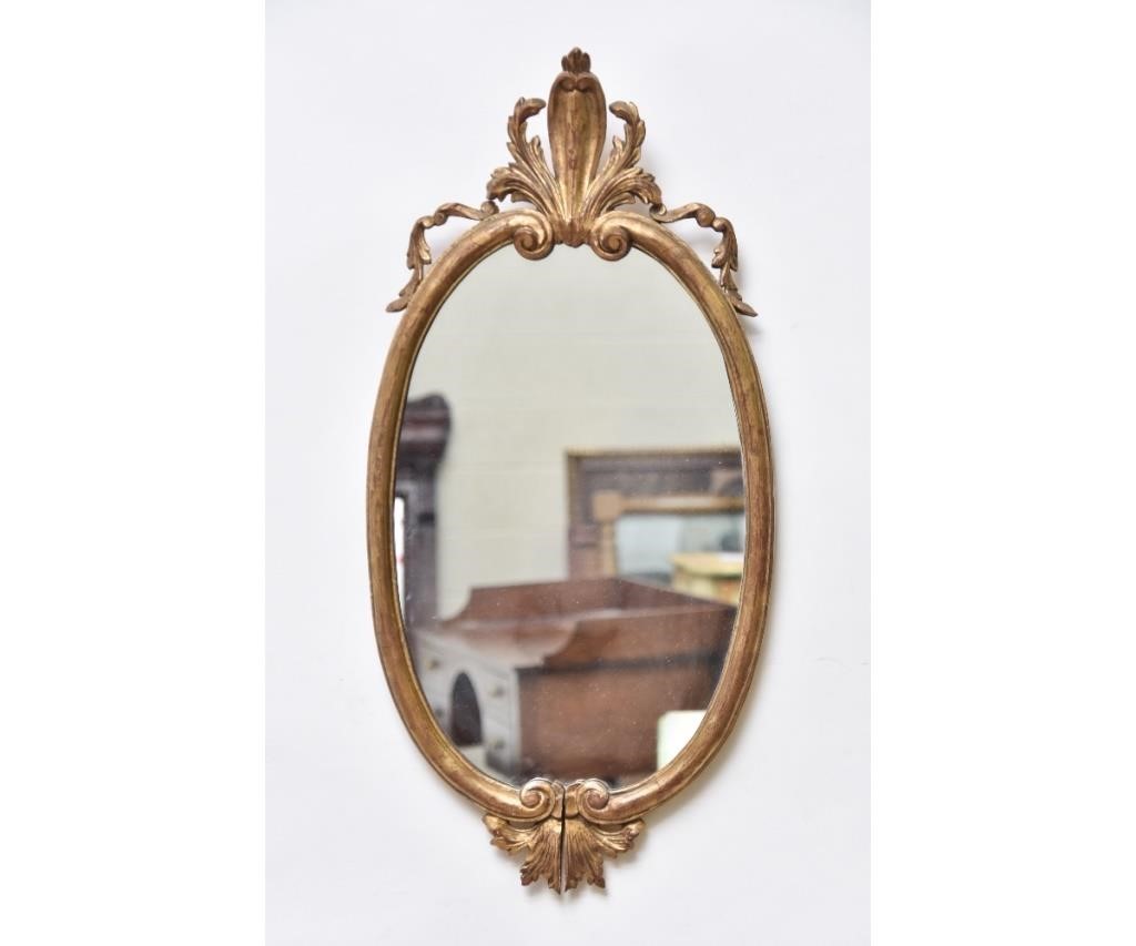 Italian gilt carved oval mirror,