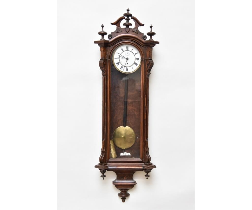 Walnut regulator clock with porcelain