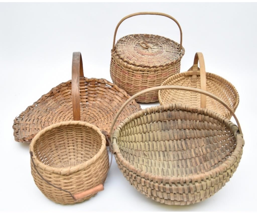 Five woven baskets, largest 14h x 21d