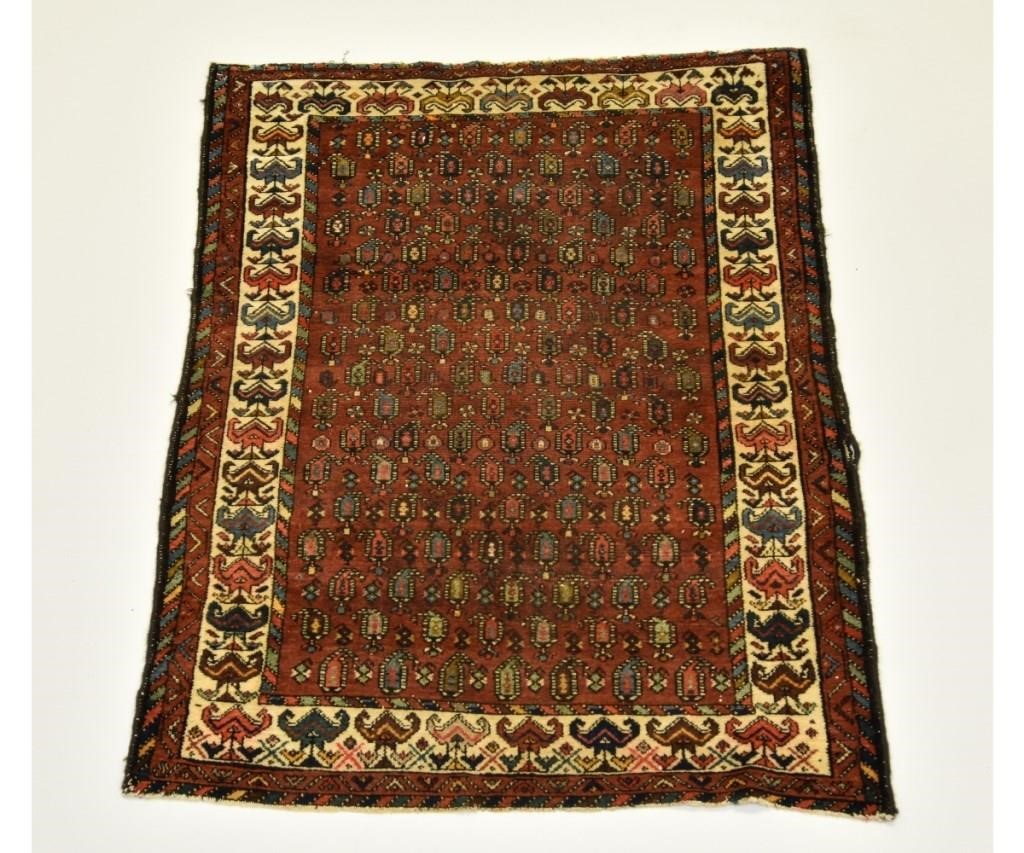 Persian mat with red field geometric