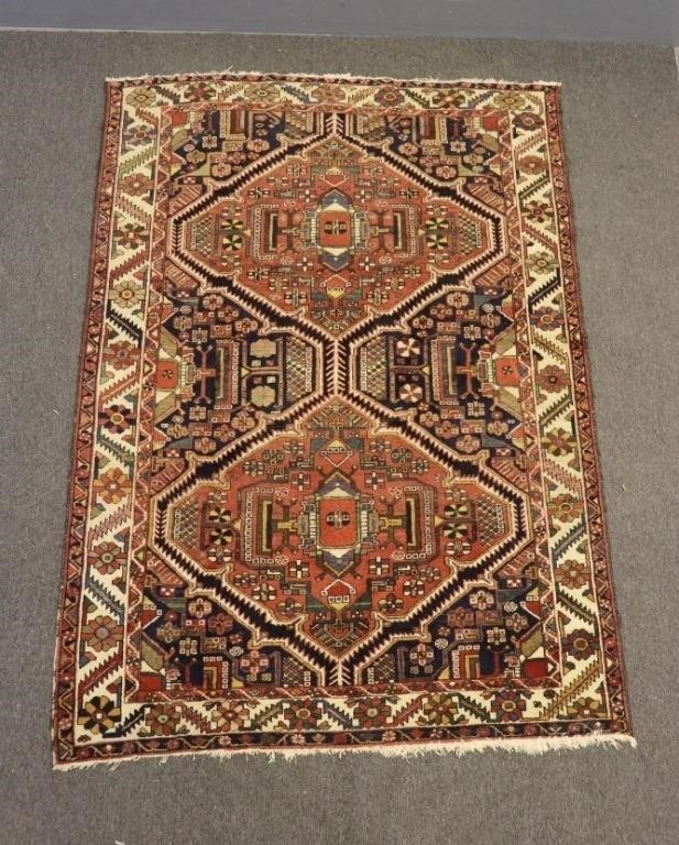 Colorful Persian center hall carpet