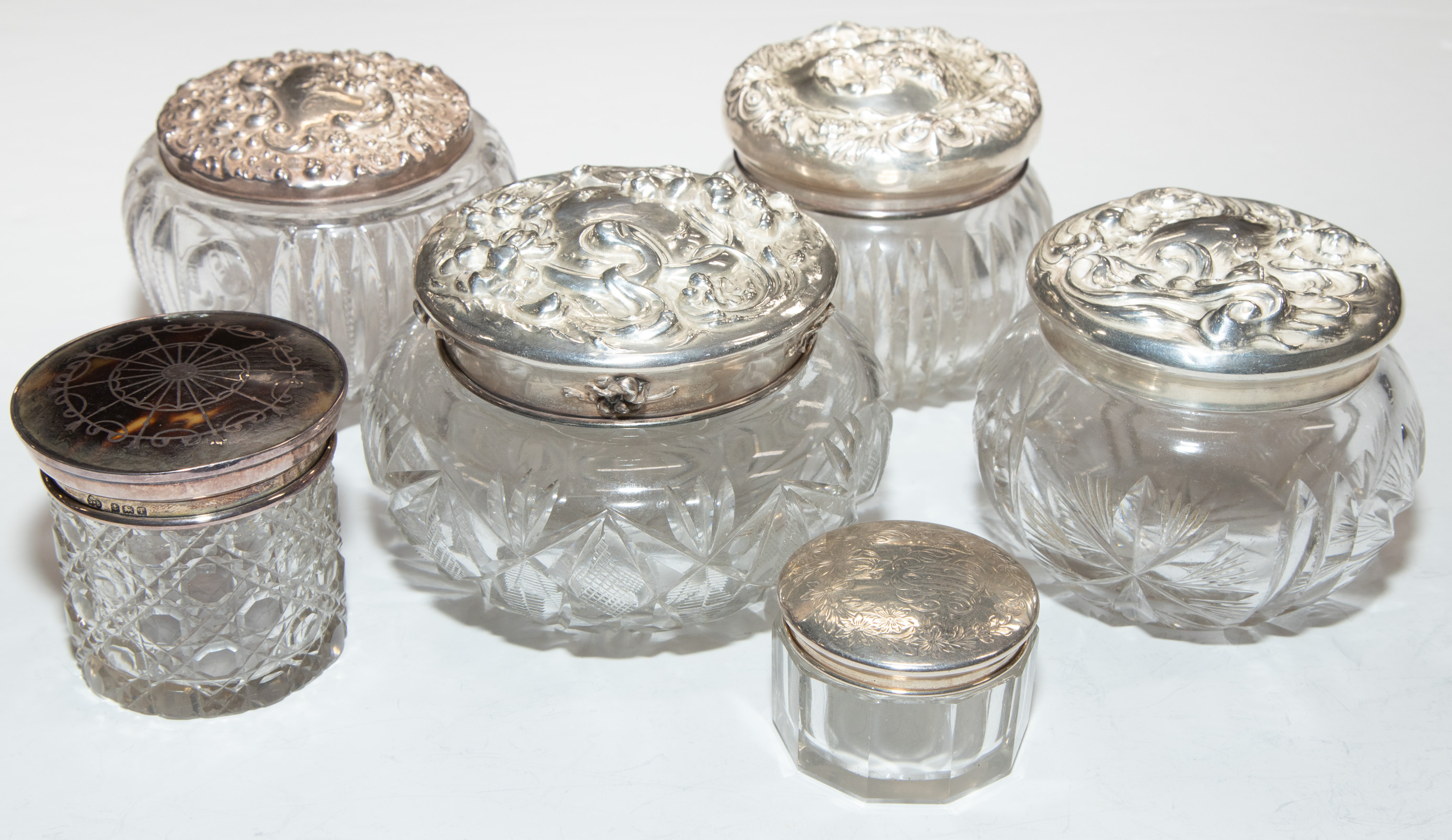 SIX SILVER-MOUNTED CRYSTAL DRESSER