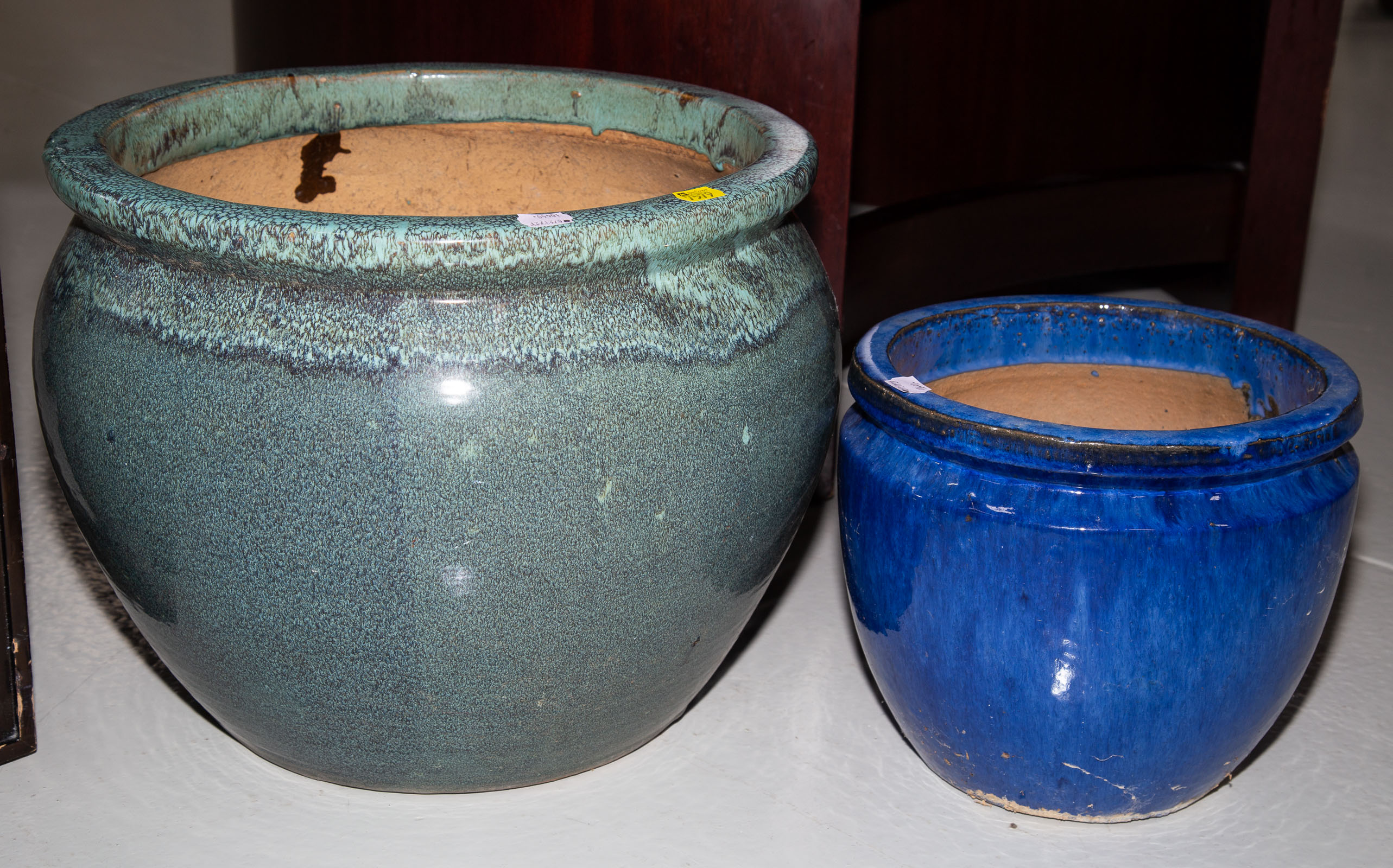 TWO MODERN POTTERY PLANTERS .