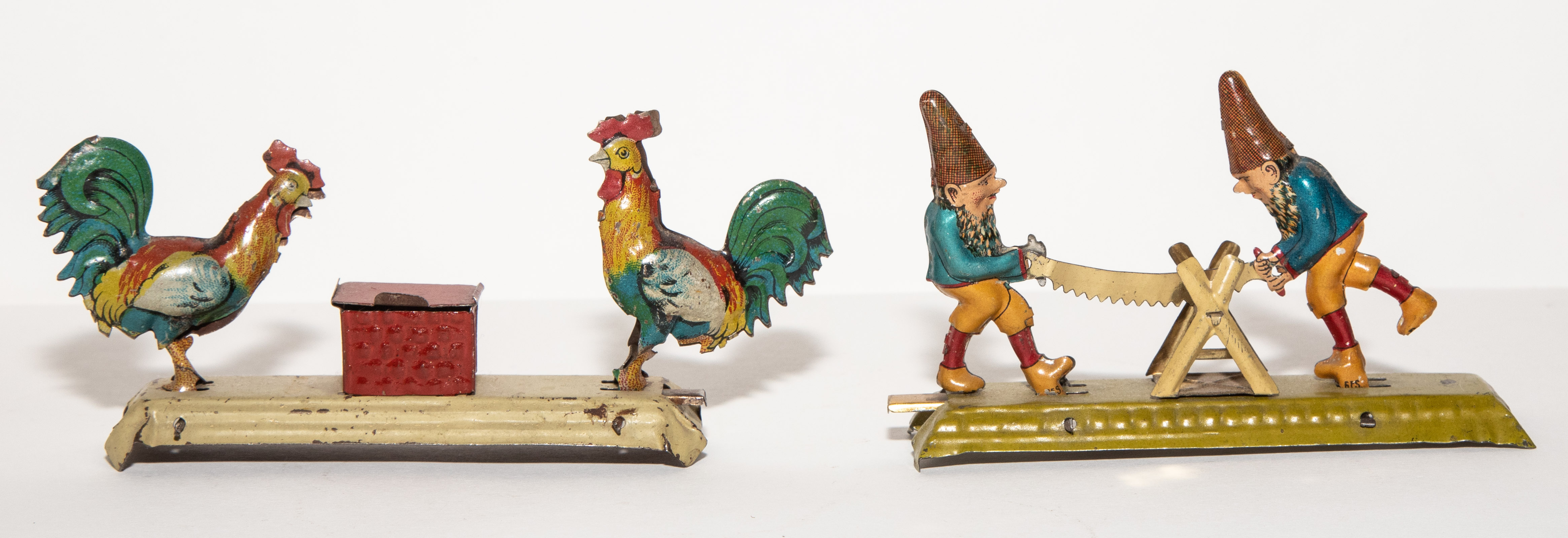 TWO GERMAN ACTION PENNY TOYS Early