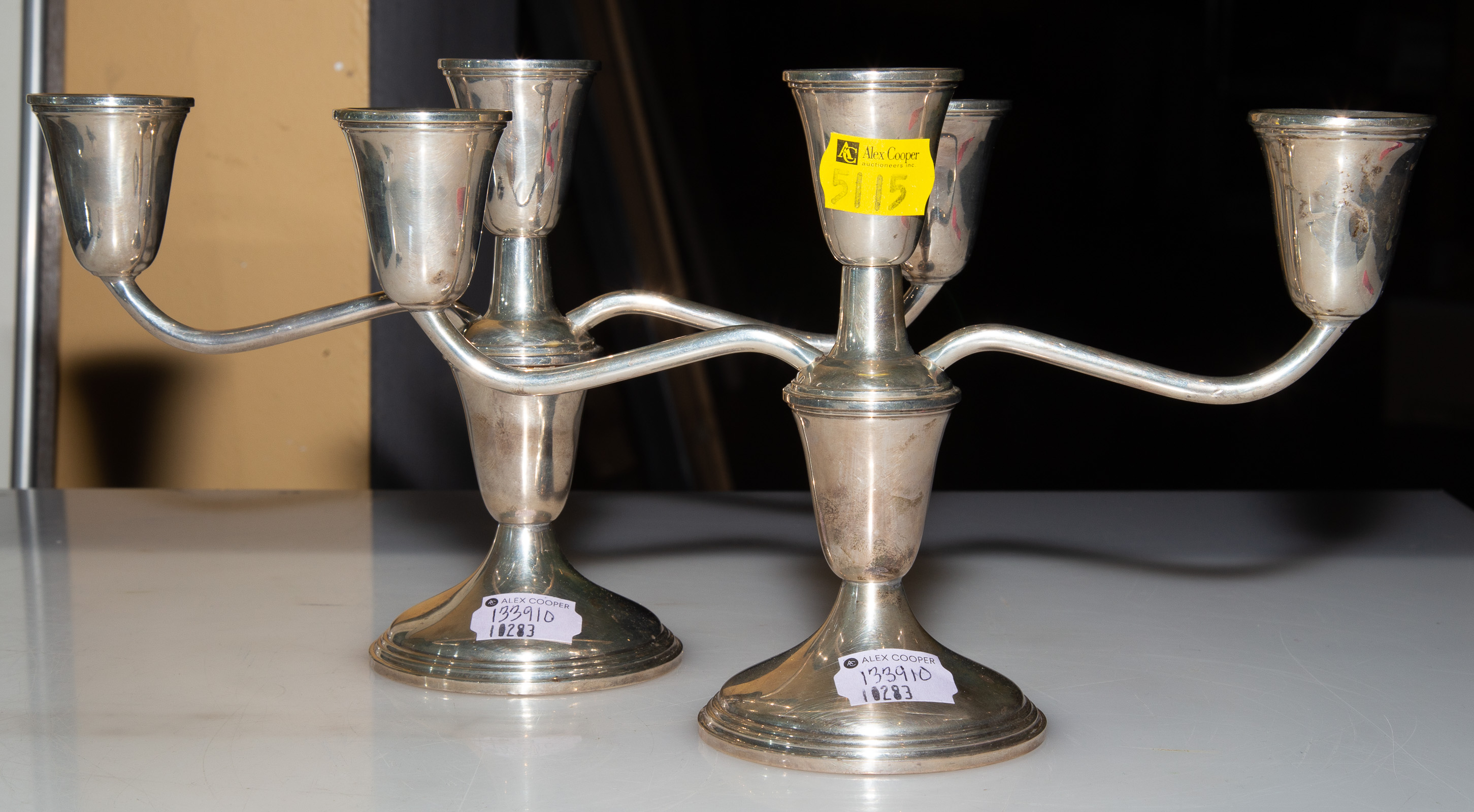 A PAIR OF STERLING WEIGHTED THREE-LIGHT