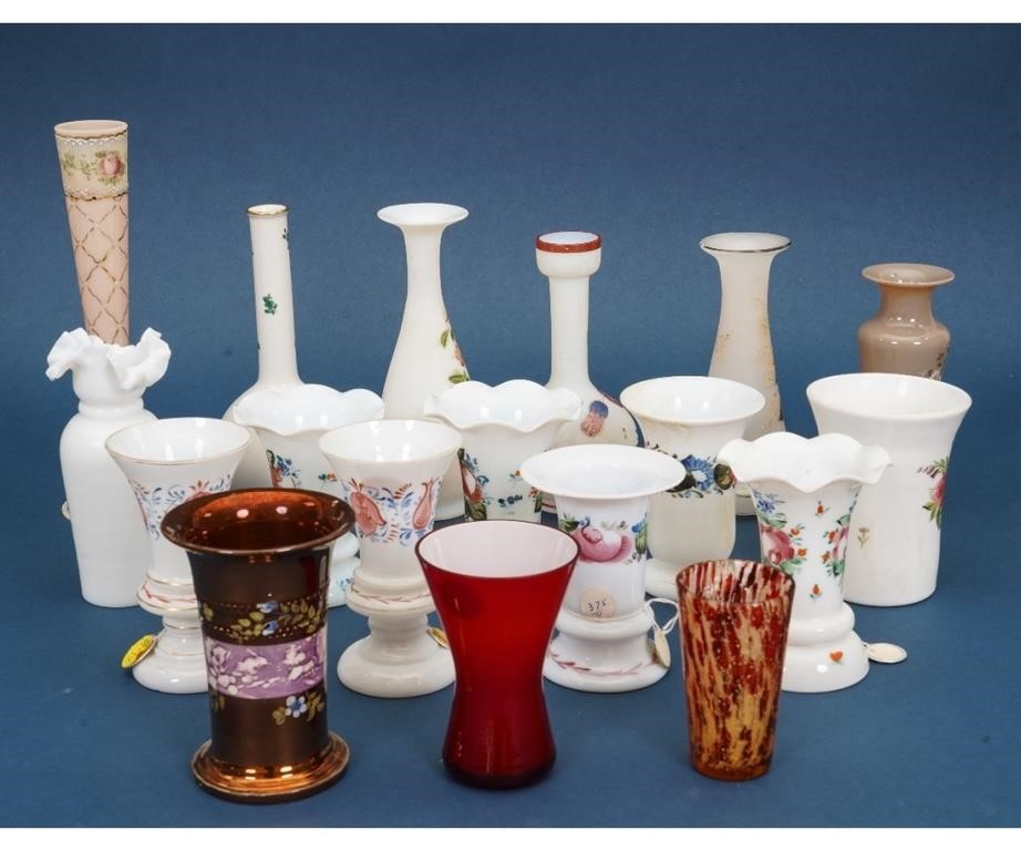 Eighteen glass vases, many with