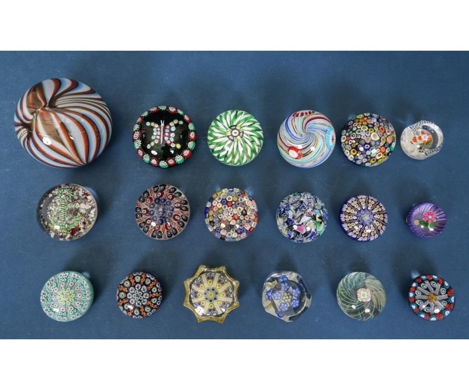 Eighteen glass paperweights, some