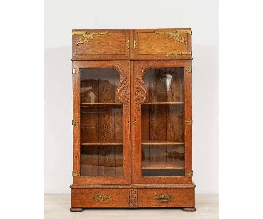 Two-door oak and glass cabinet, circa