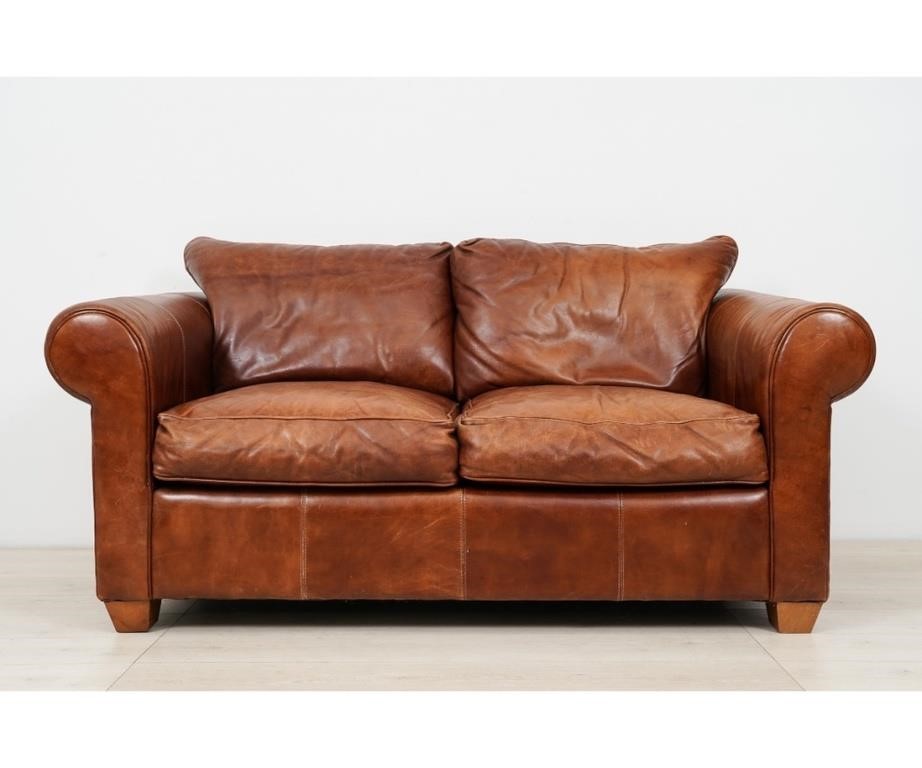 Brown leather stitched love seat