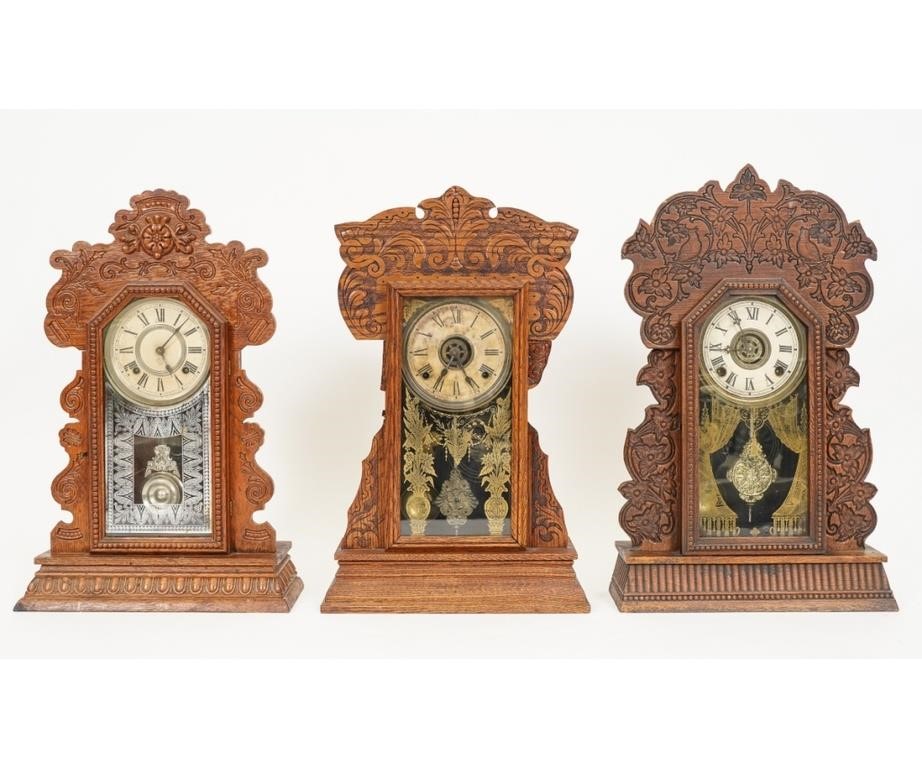 Three gingerbread oak mantel clocks