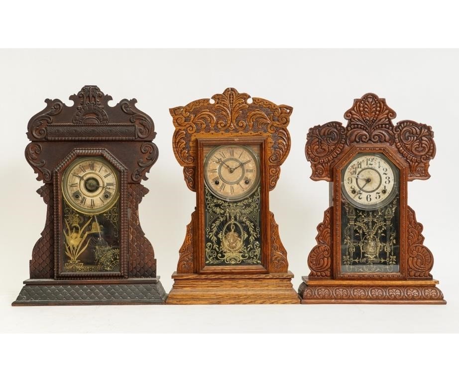 Three oak gingerbread mantel clocks,