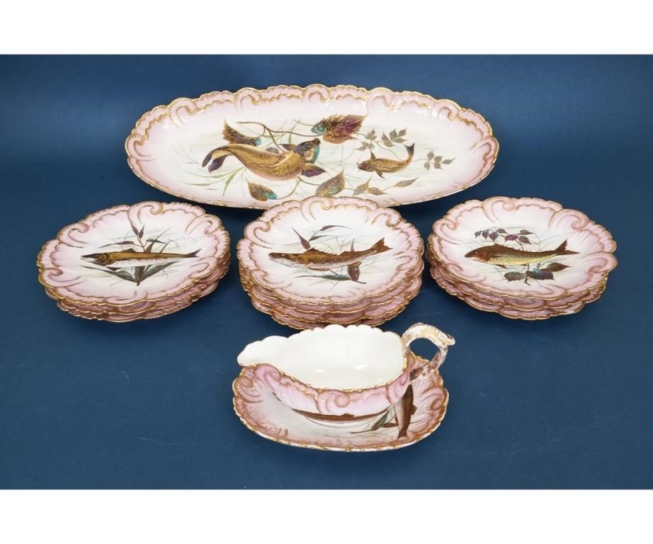 Ten Limoges fish plates; together with