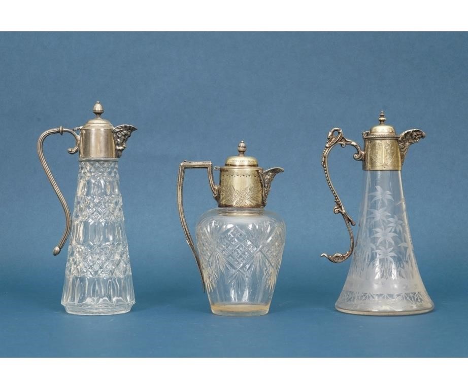 Three silverplate claret jugs  28a276