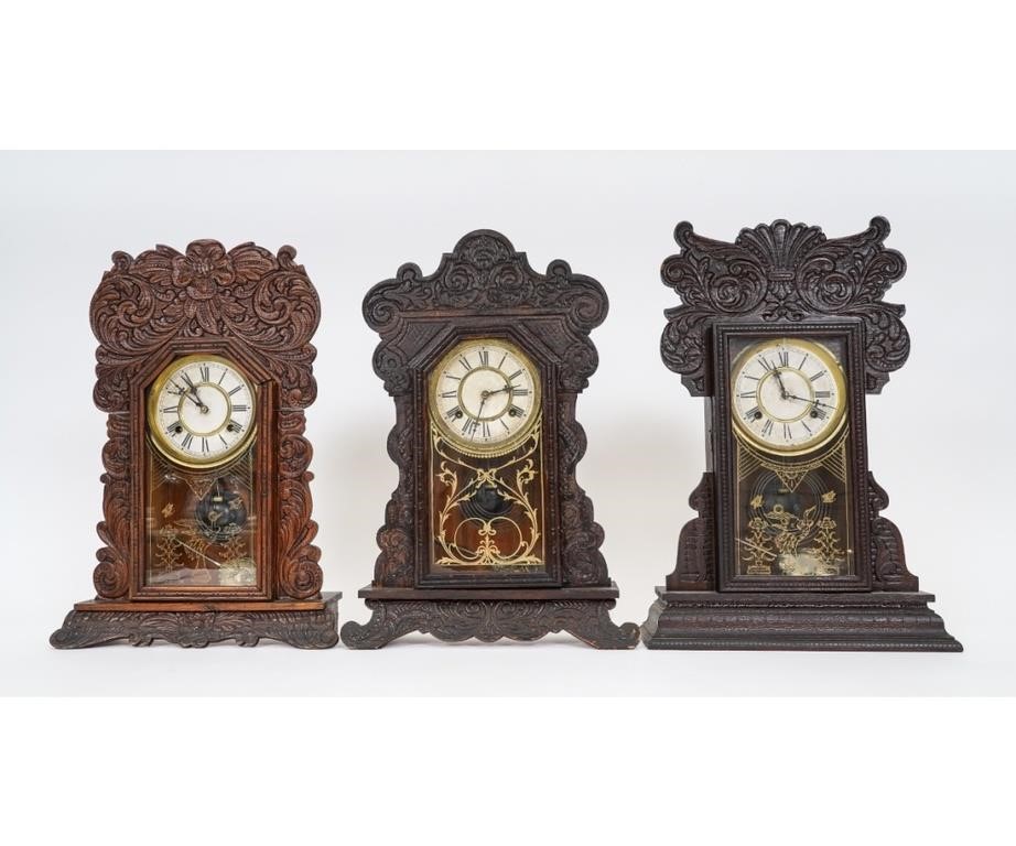 Three oak gingerbread clocks all