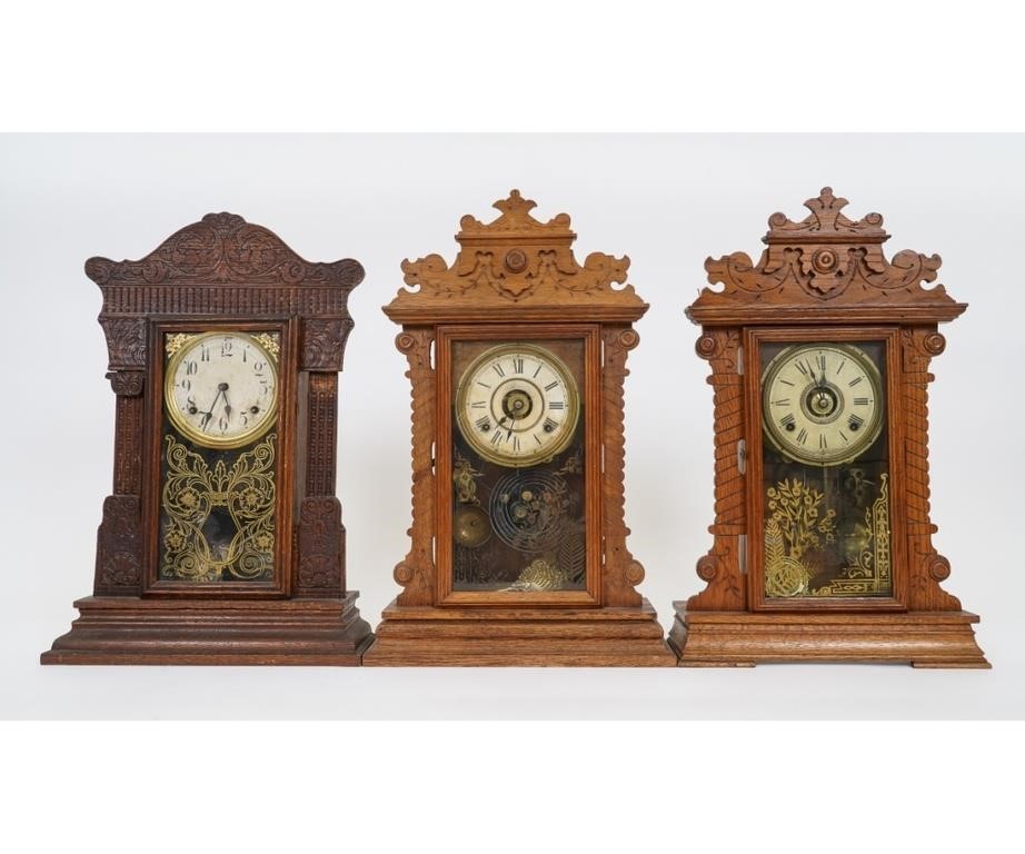 Three oak gingerbread clocks by