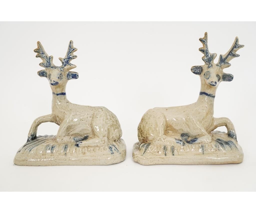 Pair of stoneware recumbent stags  28a3ea