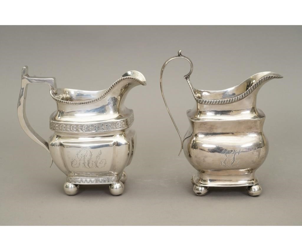 Two coin silver pitchers by Harvey