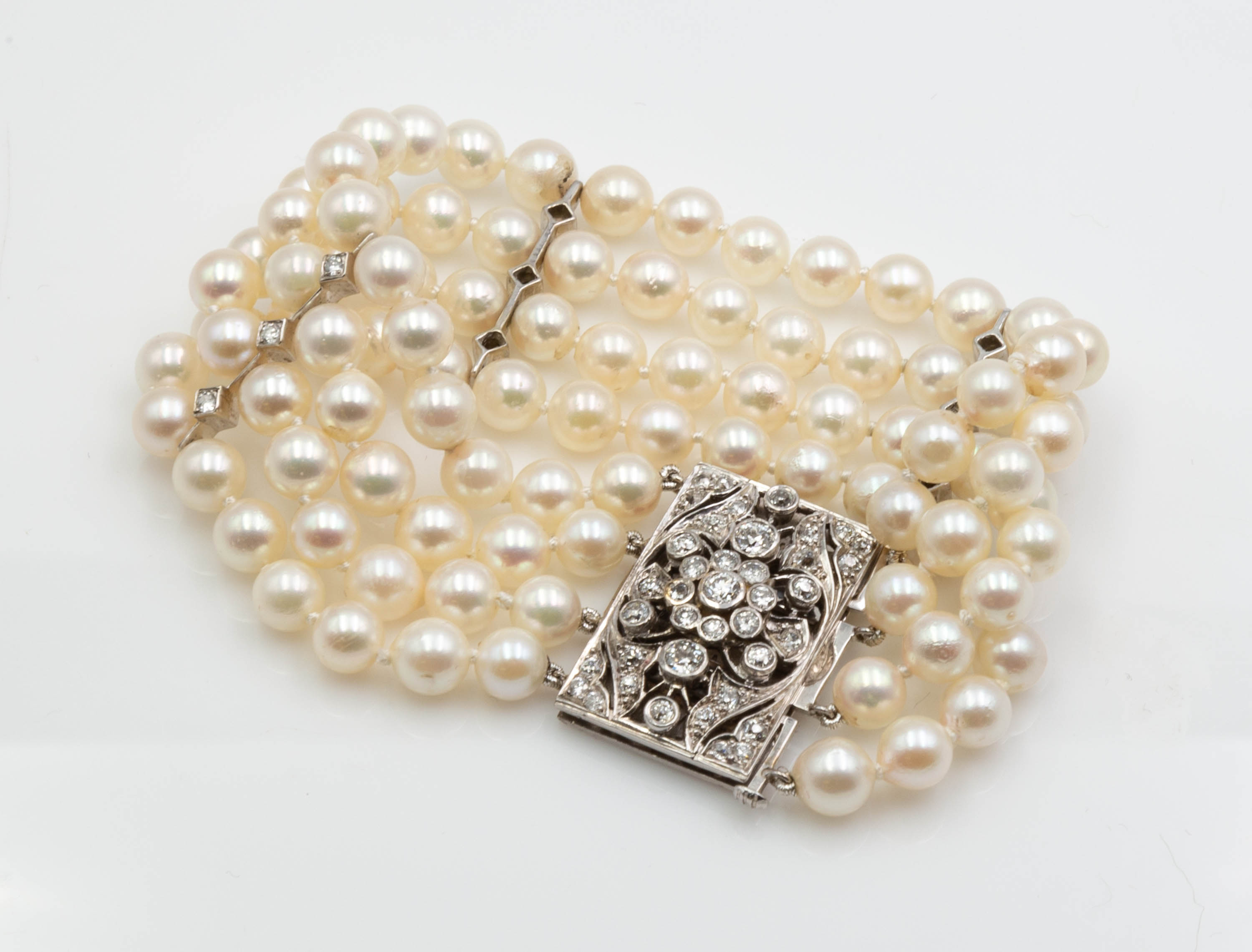 FOUR STRAND PEARL BRACELET WITH