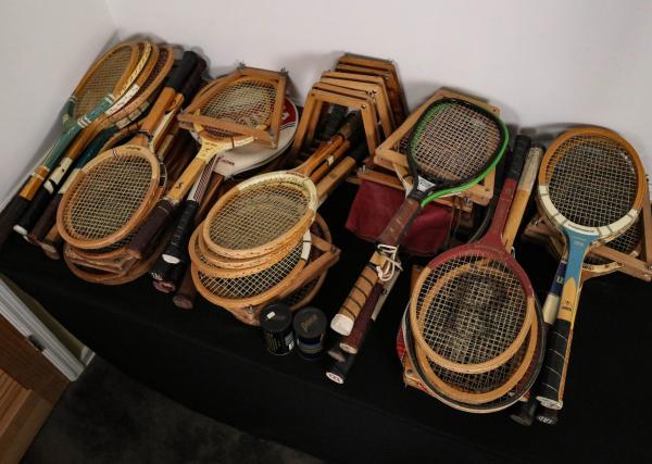 A LARGE COLLECTION OF TENNIS RACKETSAs
