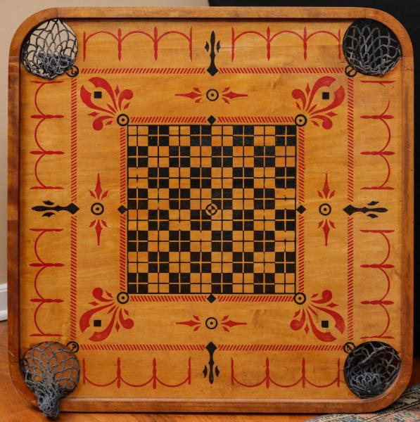 AN ANTIQUE CARROM BOARD CIRCA 1902The