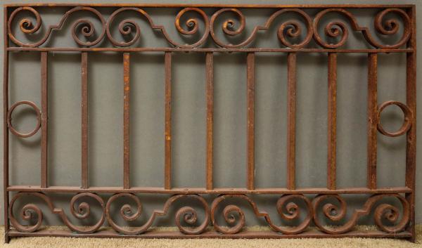 AN ANTIQUE IRON ARCHITECTURAL ORNAMENTThe