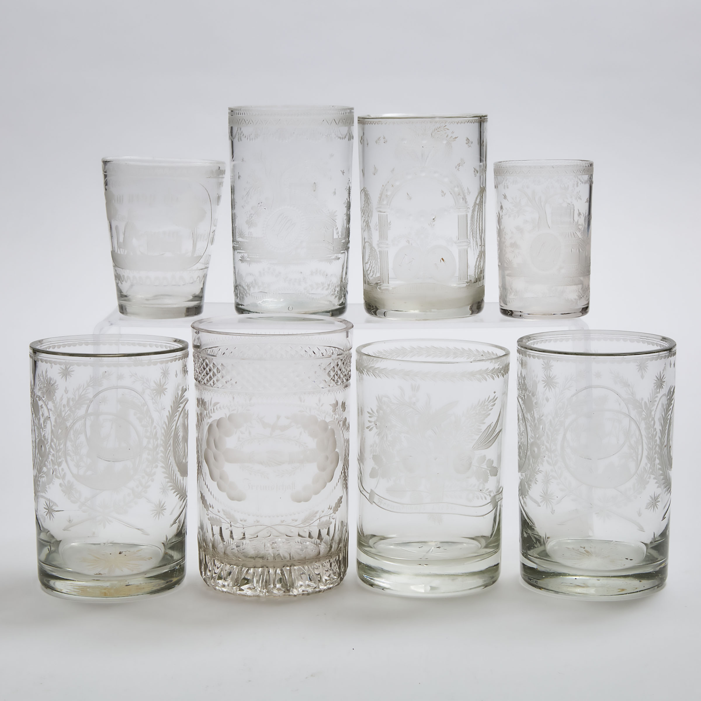 Eight Bohemian Engraved Glass Beakers  28c087