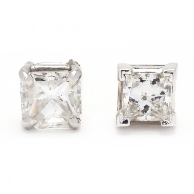 TWO SINGLE DIAMOND STUD EARRINGS