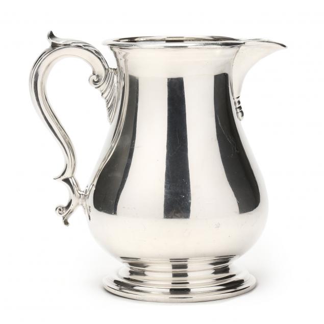 A STERLING SILVER WATER PITCHER