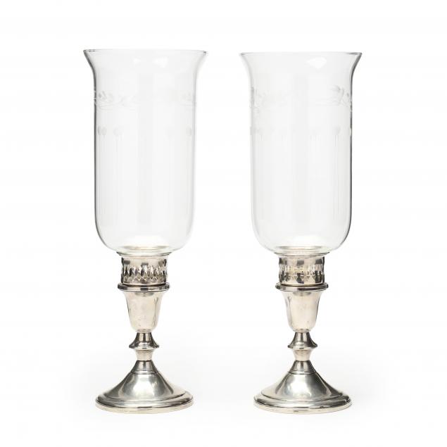 A PAIR OF STERLING SILVER CANDLESTICKS