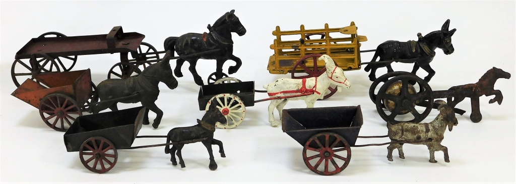 7 AMERICAN CAST IRON ANIMAL DRAWN CARTS