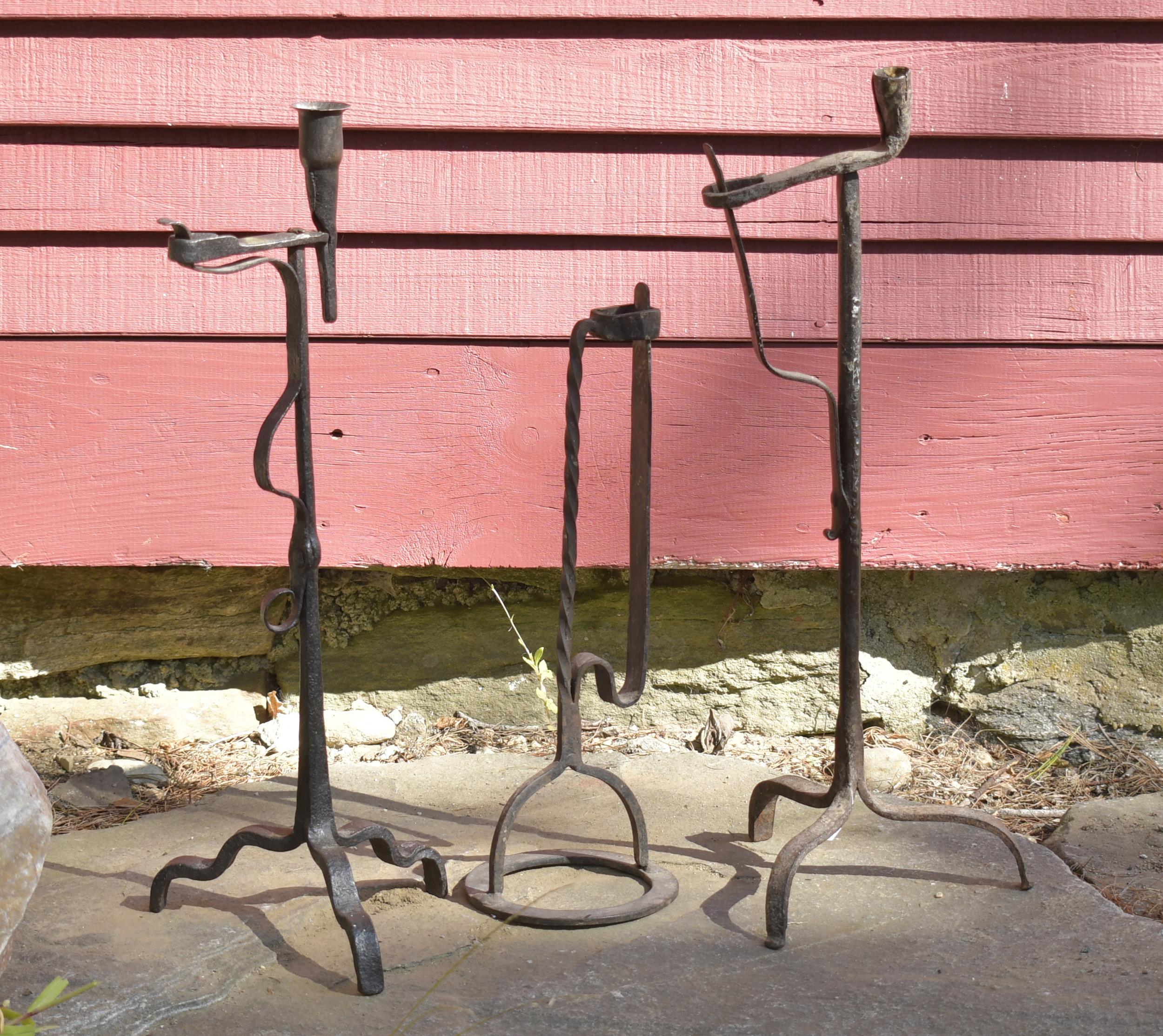 THREE EARLY IRON LIGHTING DEVICES.