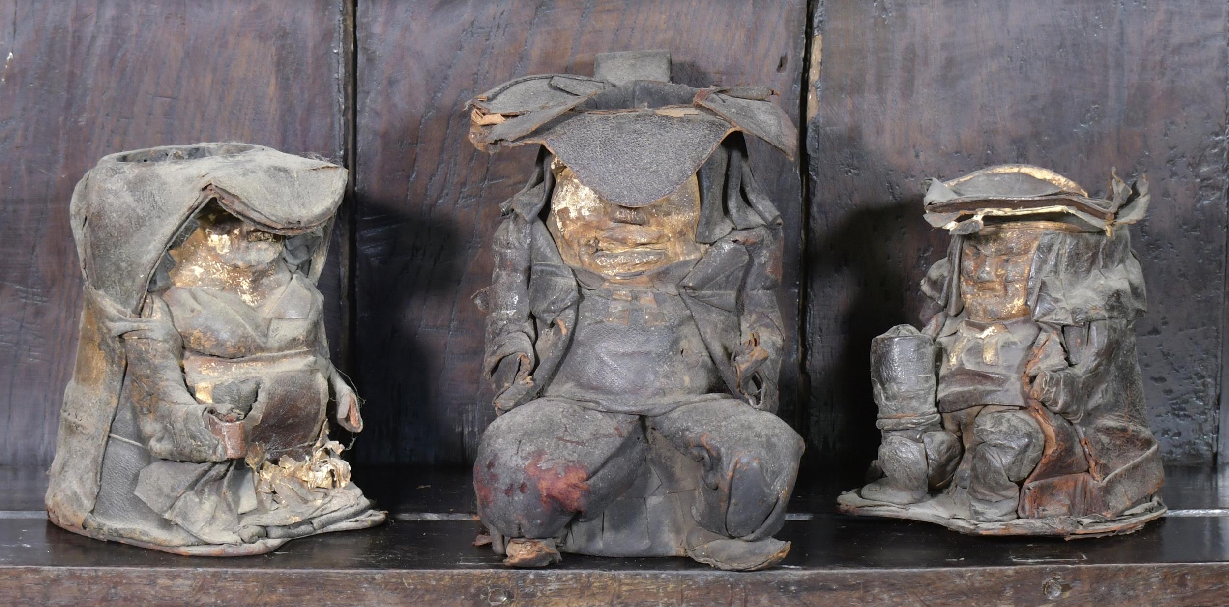 THREE 18TH C. LEATHER TOBY MUGS.