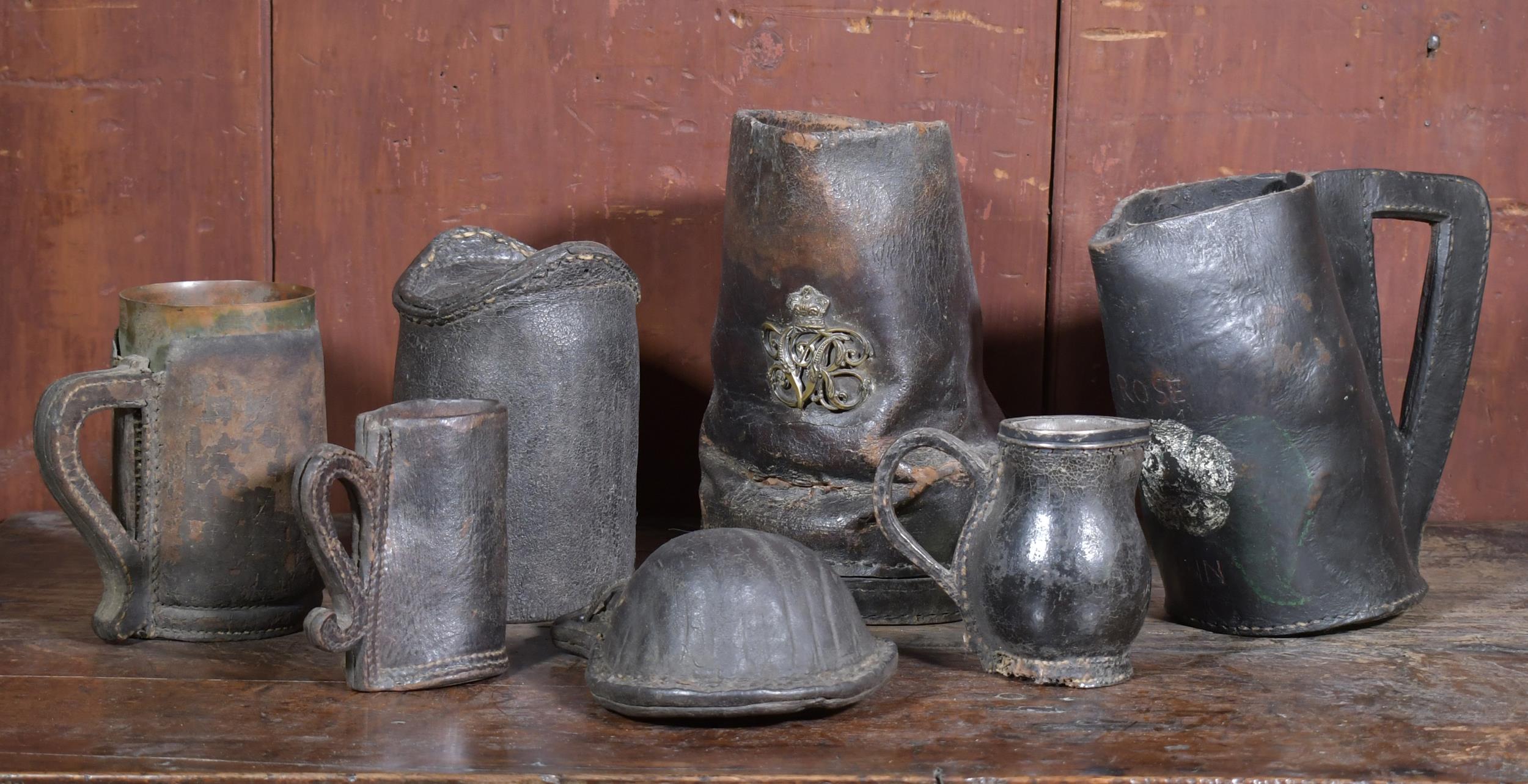 COLLECTION OF EARLY LEATHER VESSELS,