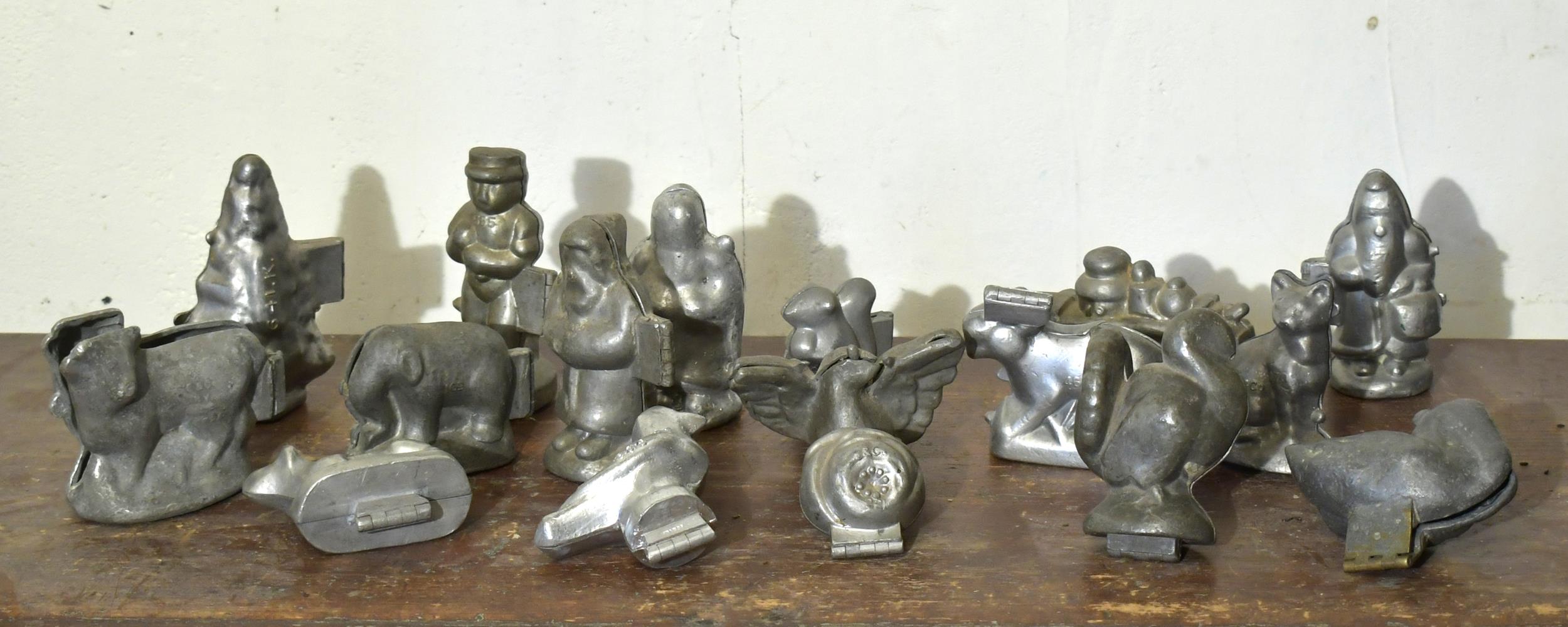 17 VINTAGE PEWTER CHOCOLATE MOLDS. Figural,