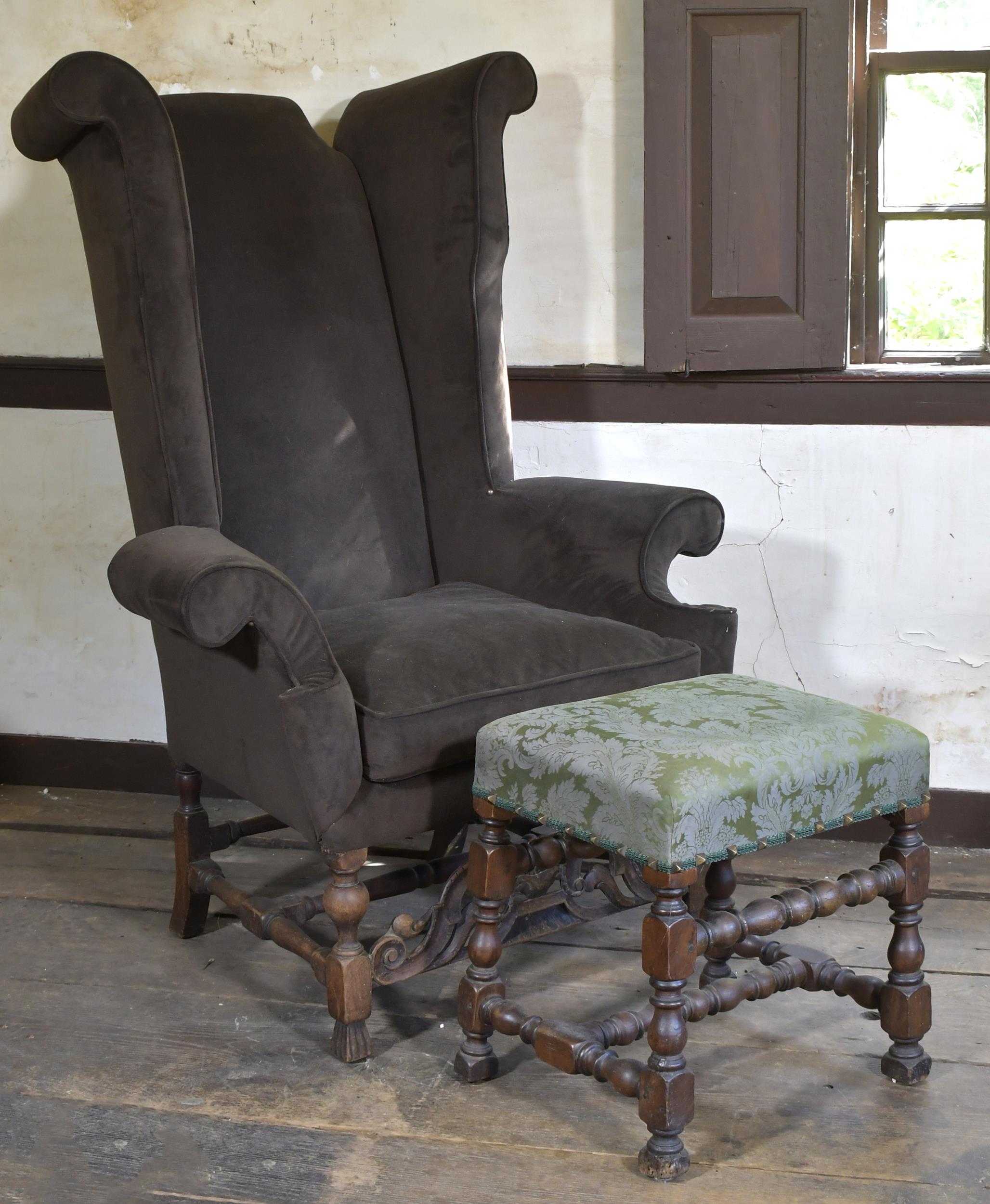 ANTIQUE WING CHAIR AND OTTOMAN.