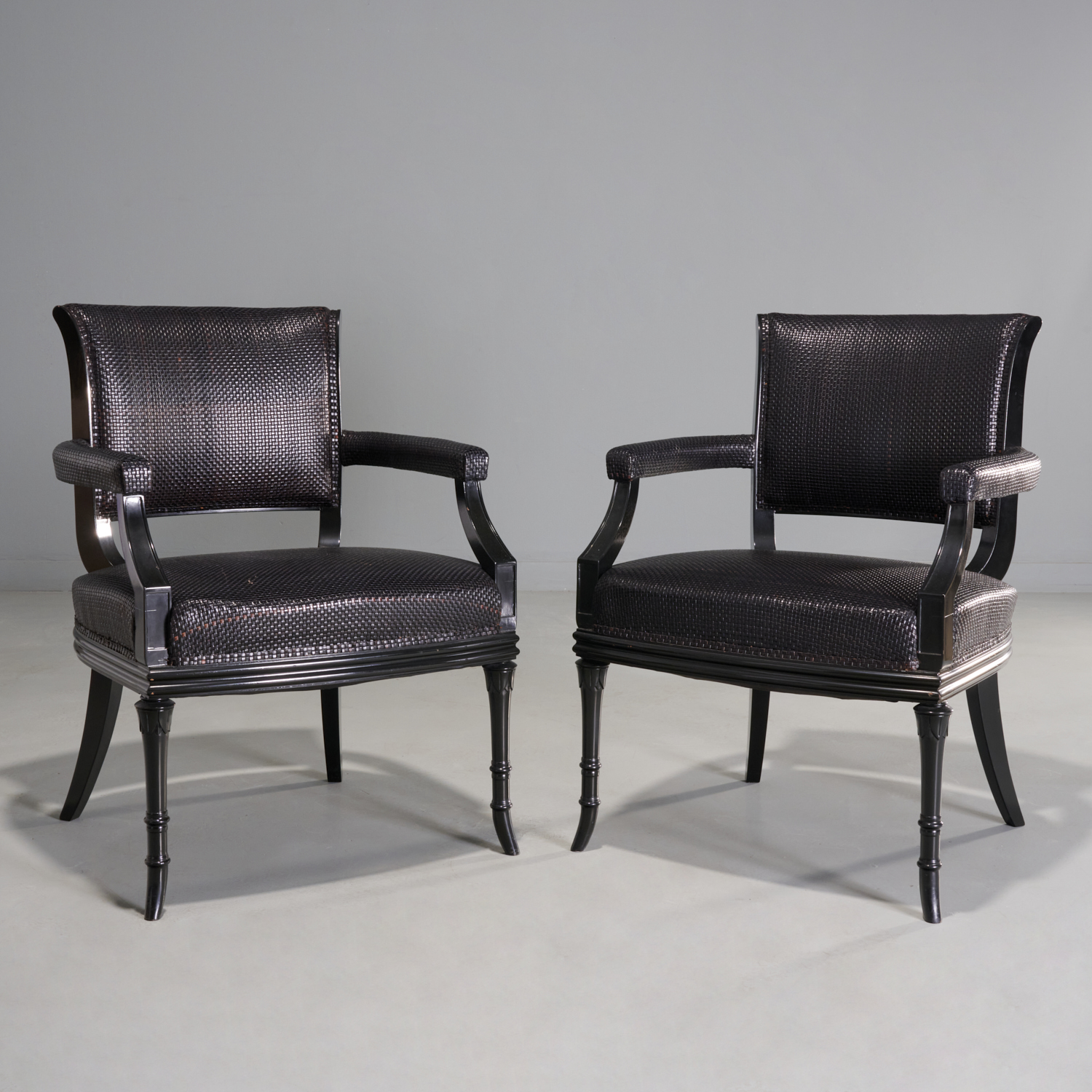 PAIR WOVEN LEATHER ARMCHAIRS, PETER