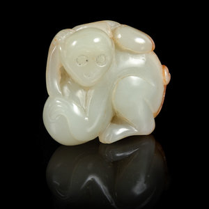A Celadon and Russet Jade Figure