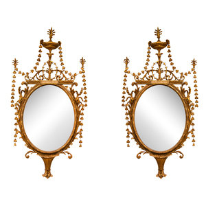 A Pair of George III Giltwood Mirrors
Late