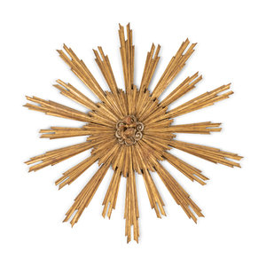 An Italian Giltwood Sunburst Ornament
Late