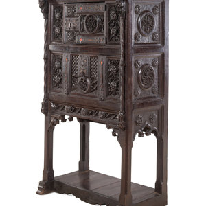A Gothic Revival Carved Walnut