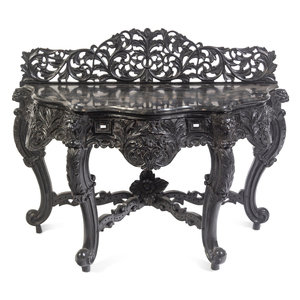 An Anglo-Indian Carved and Ebonized