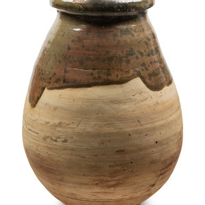 A Slip Glazed Pottery Storage Jar
Height