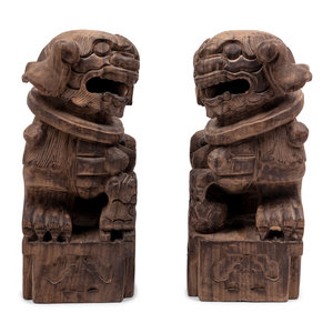 A Pair of Carved Wood Buddhistic