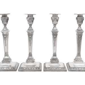 A Set of Four Silver-Plate Candlesticks
Circa